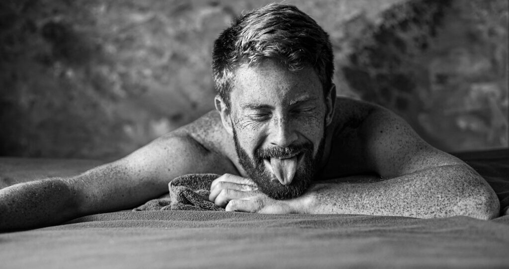 A man sticking out his tongue.