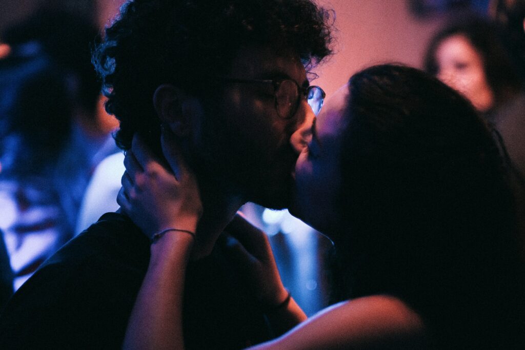 man and woman kissing