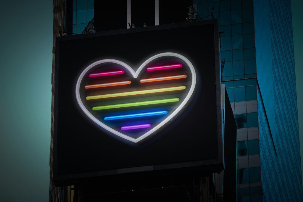 Rainbow neon heart on building