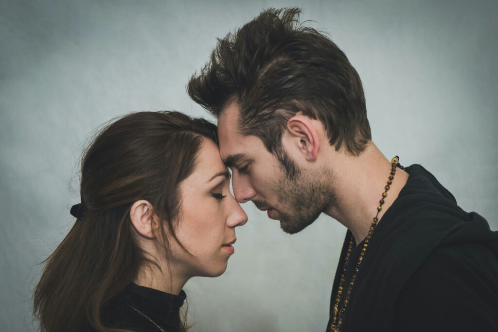 Man and woman touching foreheads.