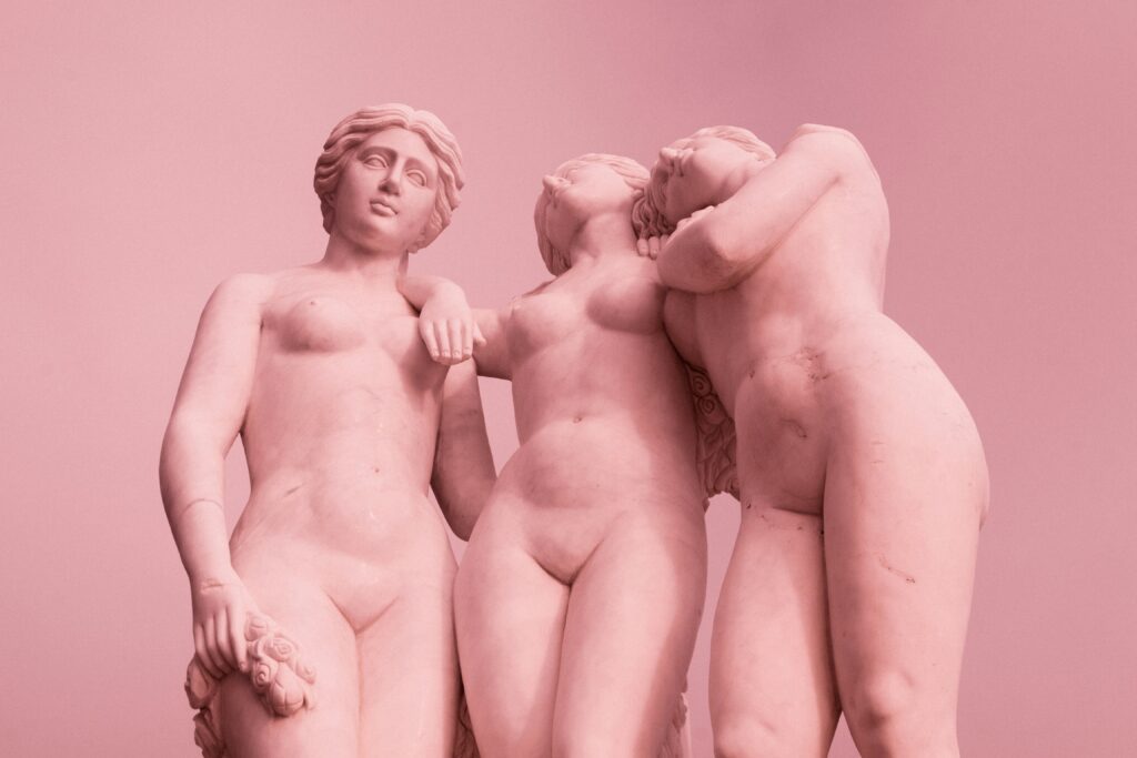 Pink statues of naked women.