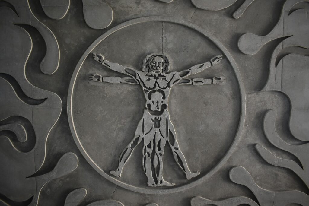 Vitruvian man engraved in stone.