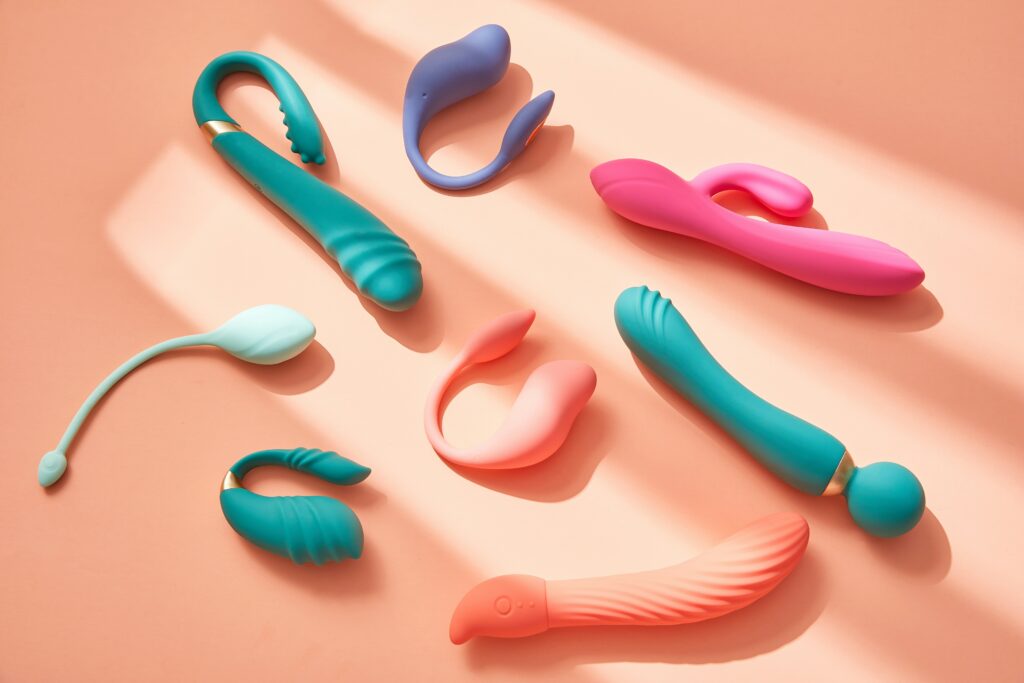 Sex toys on an orange surface