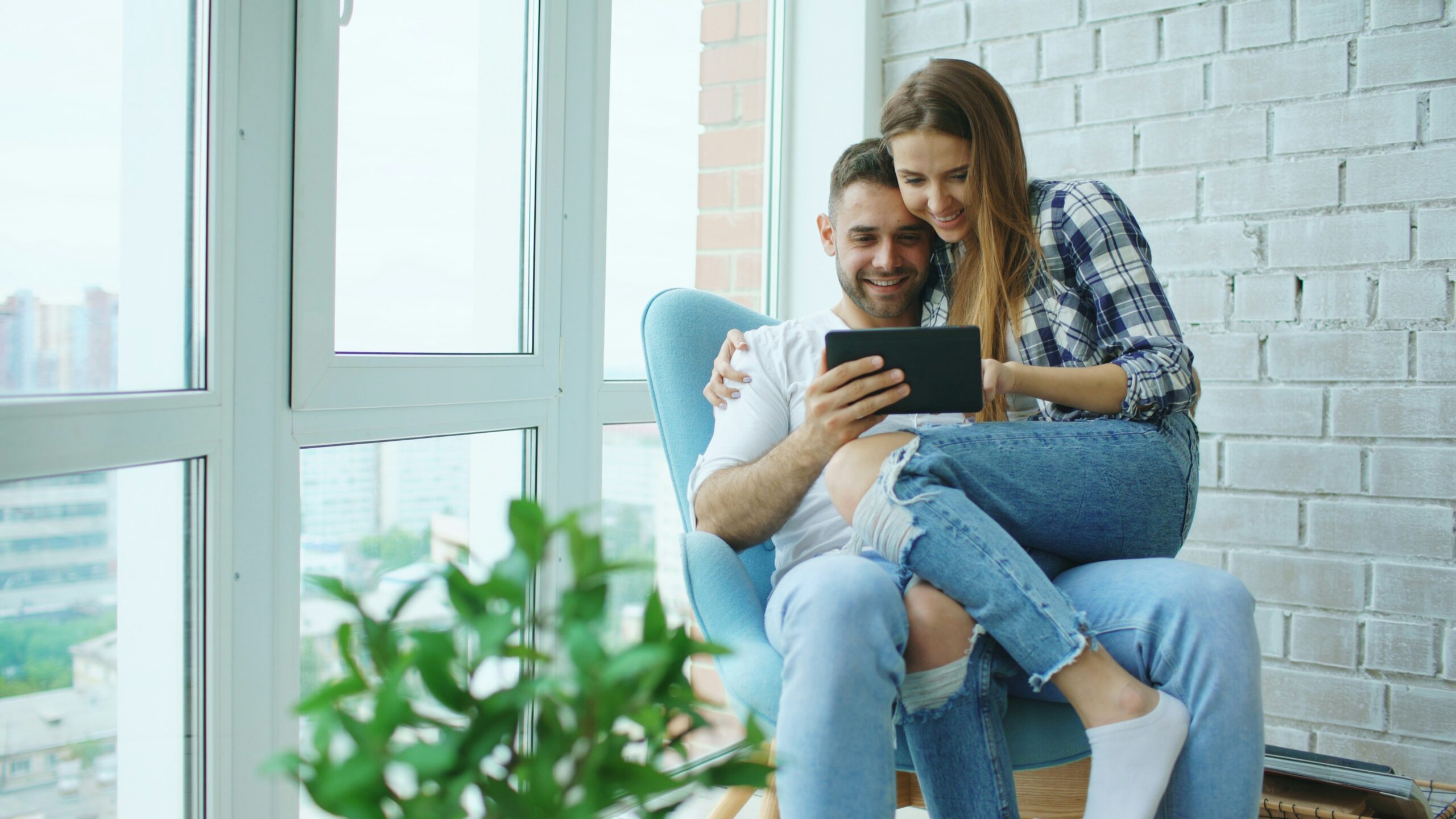 woman sitting on man’s lap