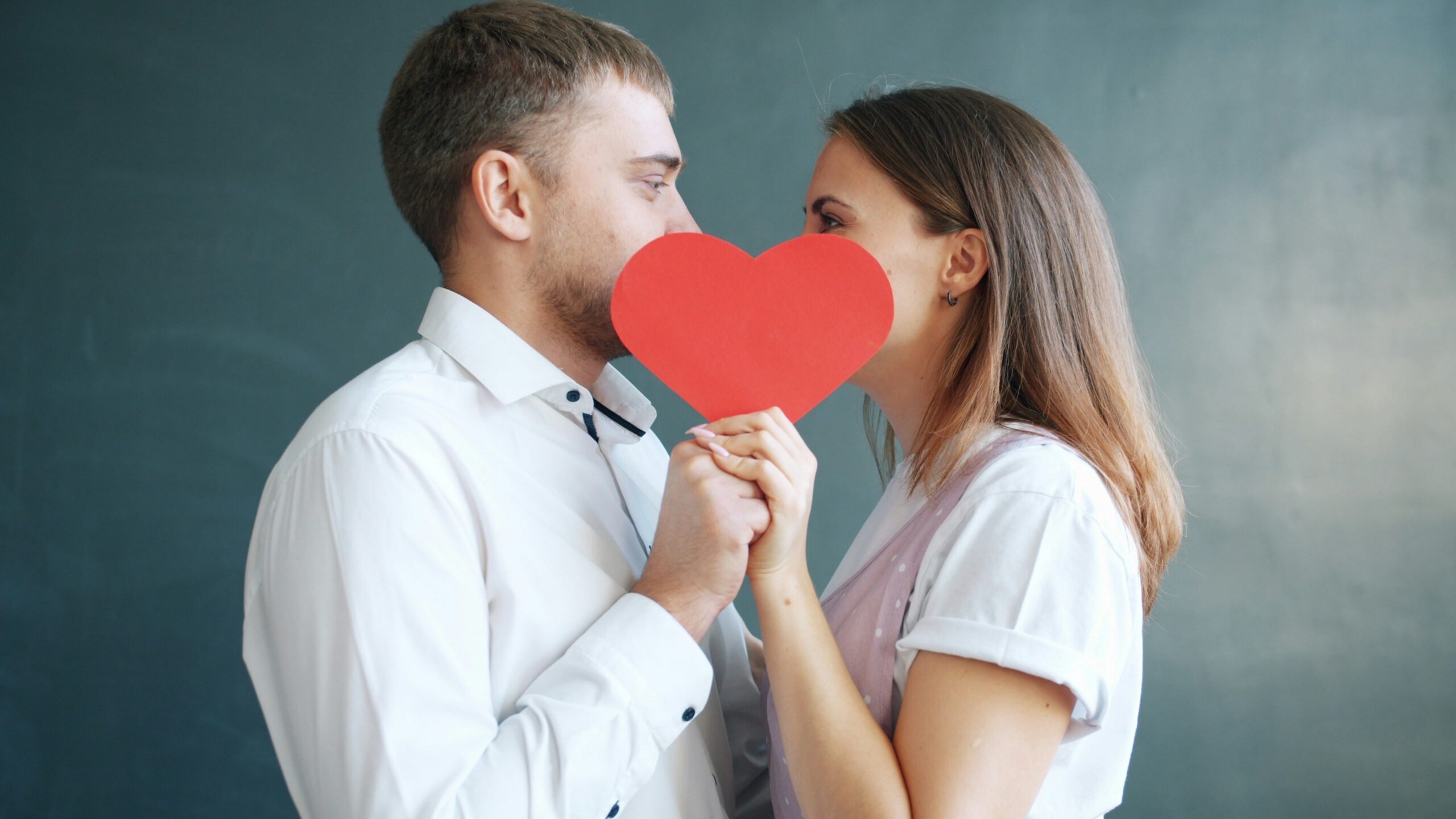 Couple holding a red heart