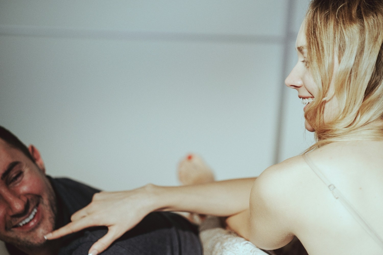 Playful woman and man smiling