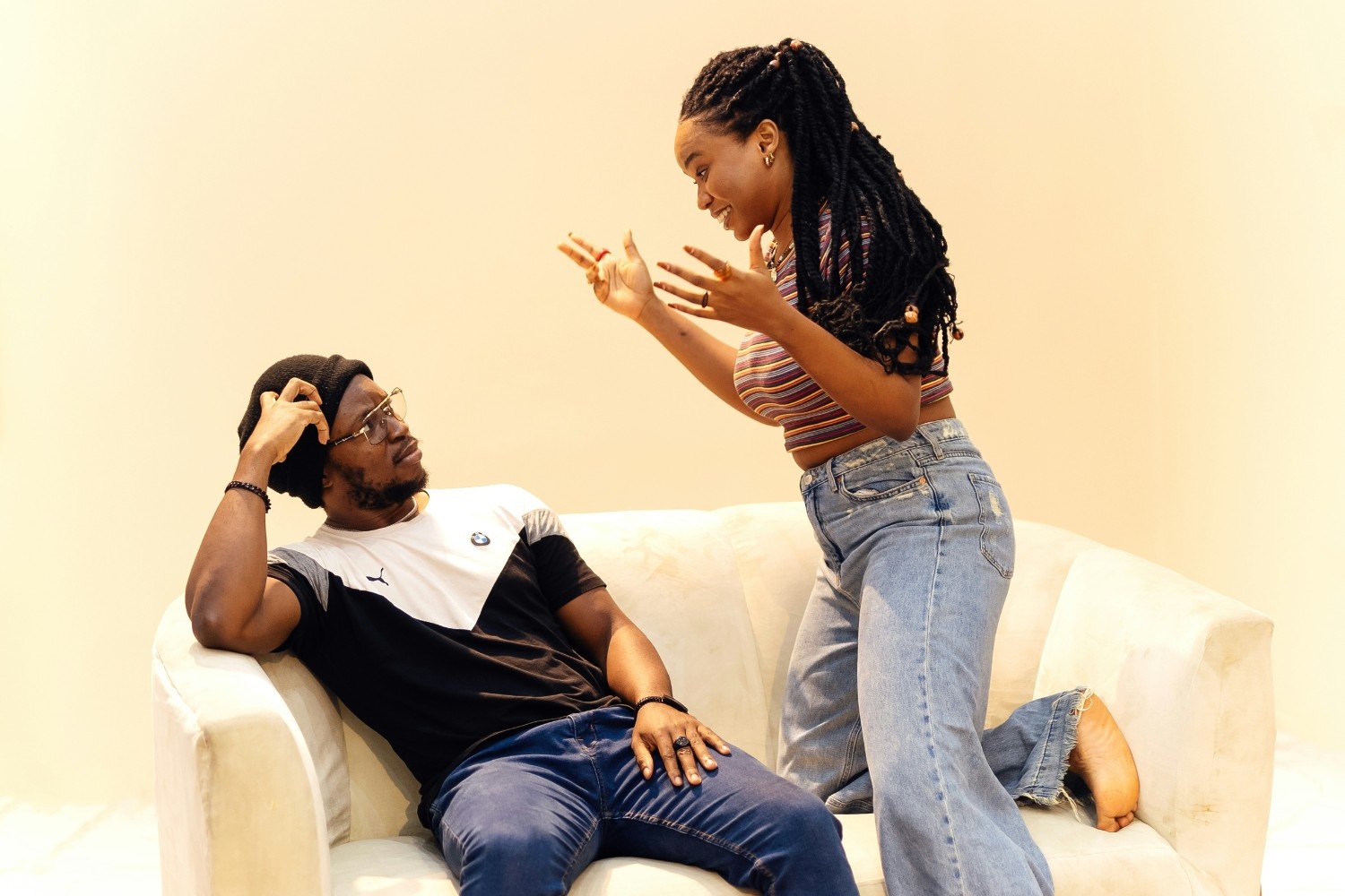 Woman and man arguing on the couch