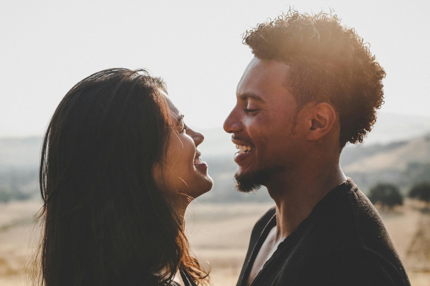 Happy couple smiling at each other