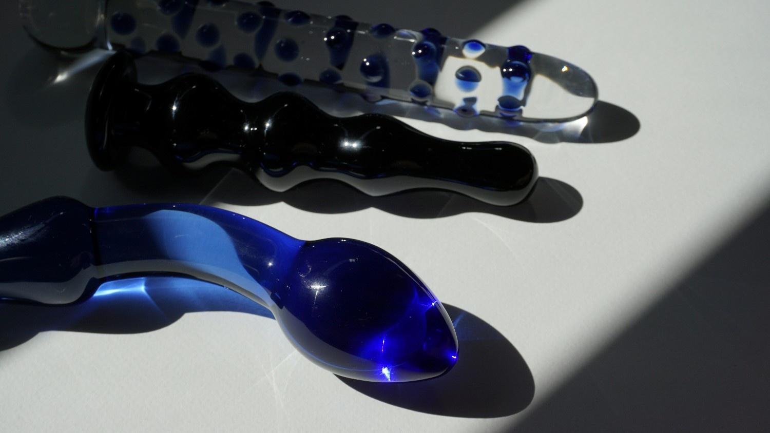 Three glass dildos