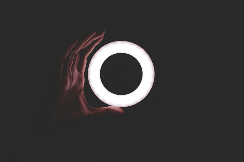 hand with ring light in the dark